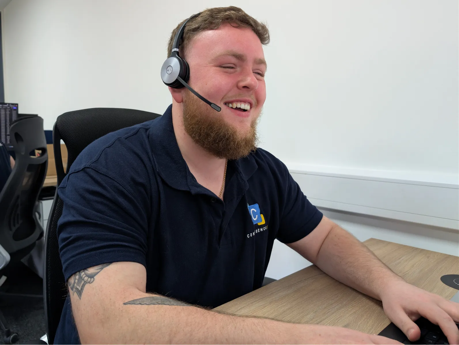 Aaran from the Confidence IT team at work in the office